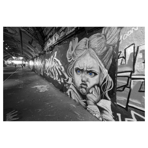 Photo of amazing streetart of a pouting child in the Leake Street Arches