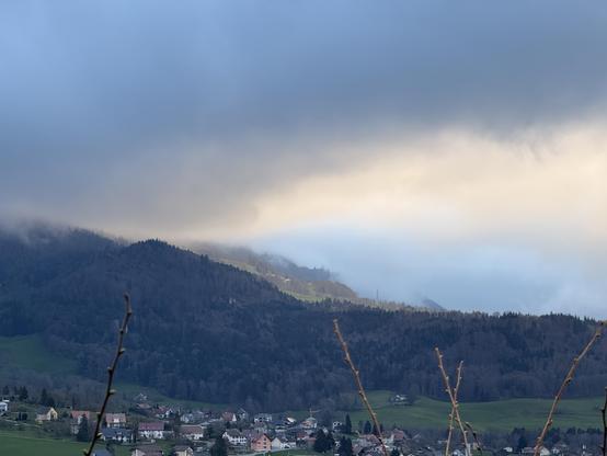Thick clouds retreating and making room for the rising sun in the morning.