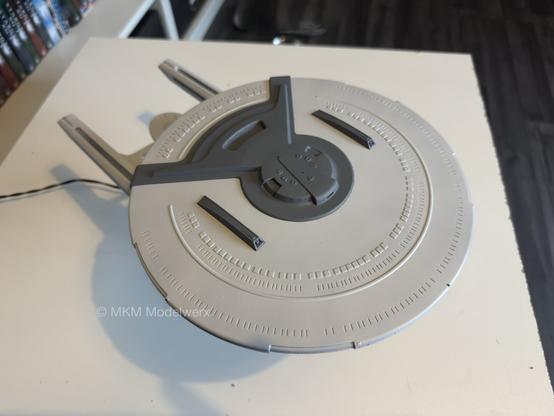 Top of the saucer showing the light grey of the main hull and a dark grey for the raised areas