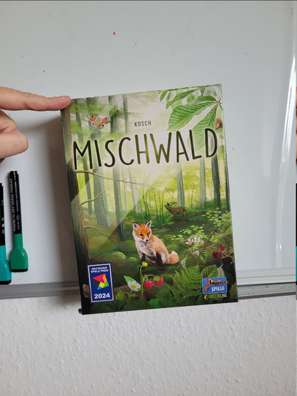 The box for Forest Shuffle in German. There's a fox in a forest on it.