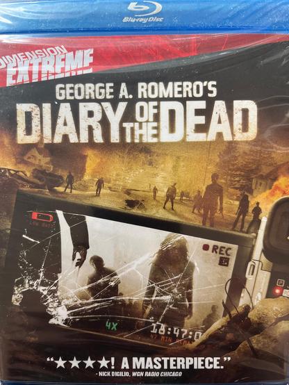 The image shows the Blu-ray cover of "George A. Romero's Diary of the Dead." The cover is predominantly black with a red and blue top section, featuring the "Dimension Extreme" logo and the Blu-ray Disc logo. The title "Diary of the Dead" is prominently displayed in large, white, distressed font. Below the title, there is a scene depicting a post-apocalyptic setting with silhouettes of people and a bus, suggesting a zombie apocalypse theme. In the foreground, there is a cracked screen with a recording interface, showing a timestamp of "18:47:00" and a "4X" magnification, indicating a first-person perspective. The bottom of the cover includes a quote from Nick Digilio of WGN Radio Chicago, stating, "★★★★★ A MASTERPIECE." The overall design conveys a sense of horror and urgency, consistent with the film's theme.