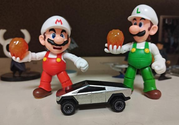 A Hot Wheels Cybertruck next to a World of Nintendo Mario and Luigi