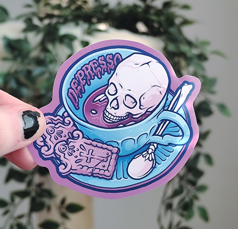 hand holding up a sticker of a cup of coffee with a skull inside, with gloopy title "depresso"