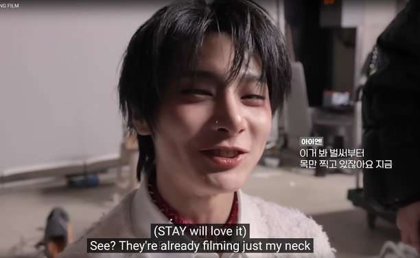 I.N looking into the camera. Caption: (STAY will love it) See? They're already filming just my neck