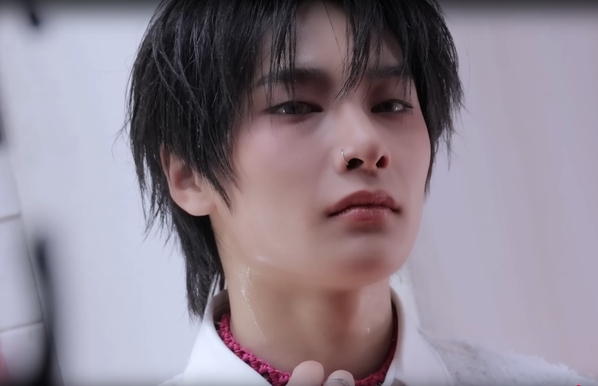 HEY. WHO ALLOWED THIS. (It's a shot of I.N with his neck looking a bit more sweaty, presumably due to expertly applied makeup.)