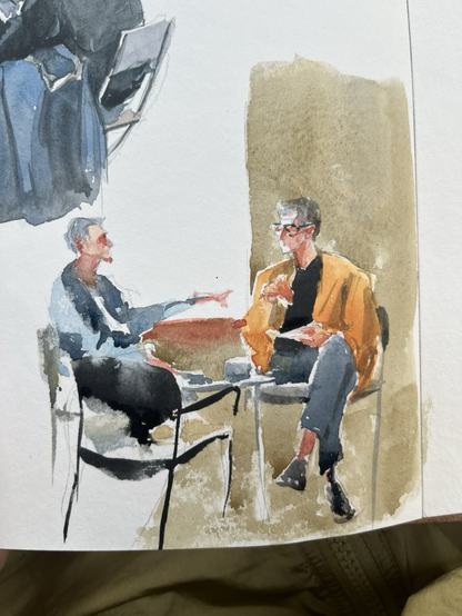 Close up of the sketch of two friends chatting