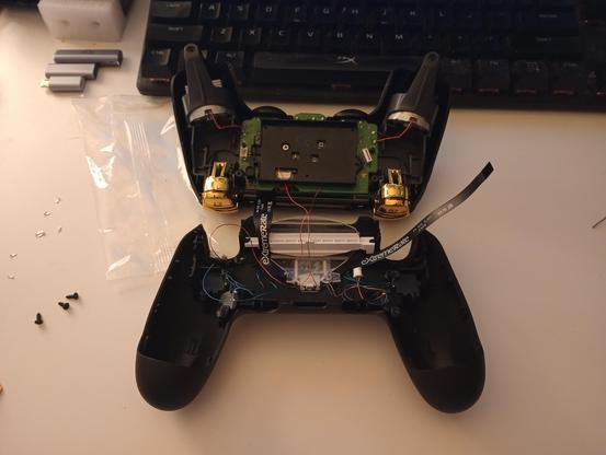 the inside of the controller. lots of wires run between the front and back halves.