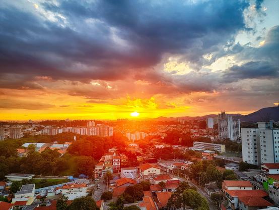 Sunset with a city in the foreground