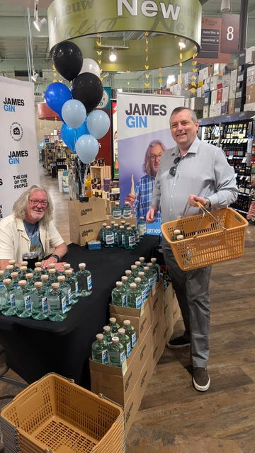 James May sitting behind a table, me with my Gin shopping basket smiling