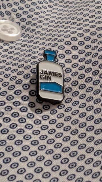 Close up of a James Gin pin on a shirt