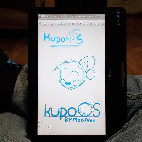 Photo of my Tablet PC Thingie. On screen is the finished sketch of a Moogle head. Below it is a logo for the fictional "Kupo O S by Mog Net". A copy of head from above is in the larger "O" in the logo. The letters are very rounded a geometric. Above everything is the initial sketch.