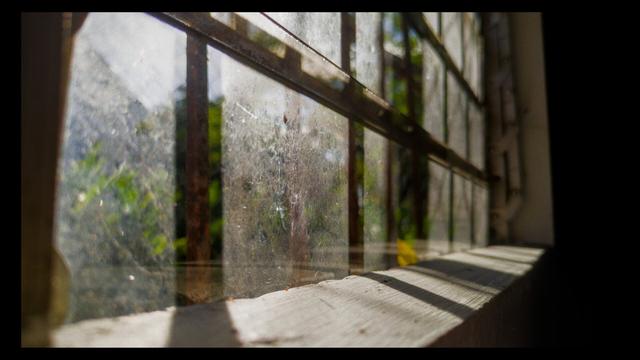 A close-up, slightly angled view of the same window, taken from the inside looking out.