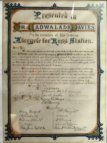 Facsimile of an illuminated manuscript presented to Mr Cadwaladr Davies. A handwritten address thanking him for his service and wishing him well in his new role at Ross Station.