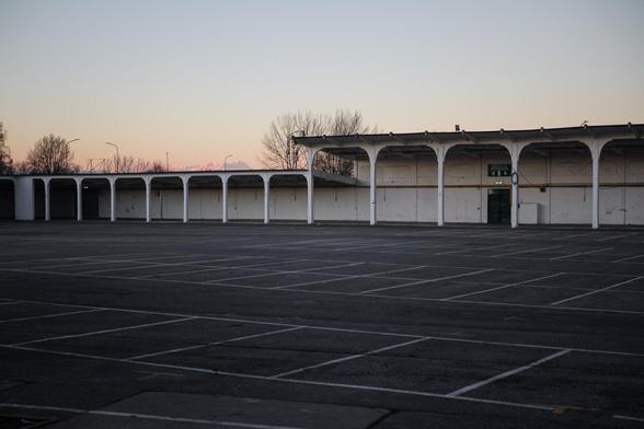 An empty parking lot at dusk.