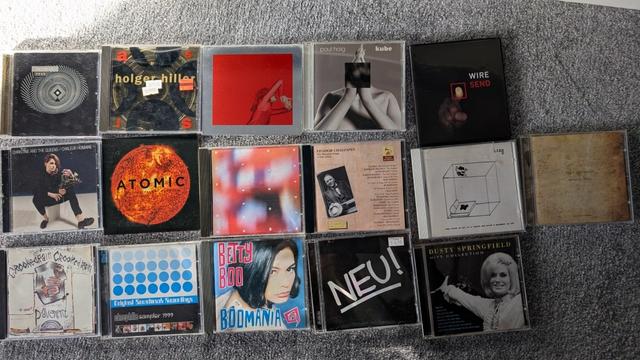 A photo of CDs on a floor with these being by :
Various Artists 'faith is fear', holger Hiller, Anika, Paul Haig, Wire
Christine and the Queens, Mogwai, Arthur Russell, Feodor Chaliapin, Liars, Seed Records volume 2
Pavement, cinephile sampler 1999, Betty Boo, Nru!  Dusty Springfield