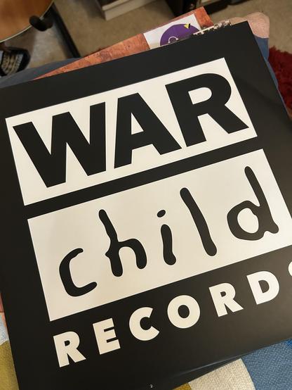 Inner sleeve, black and white with War Child Records printed in large writing.
