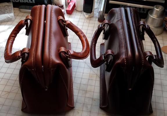 The same bags shown from the top with the bags closed and the handles folded down.