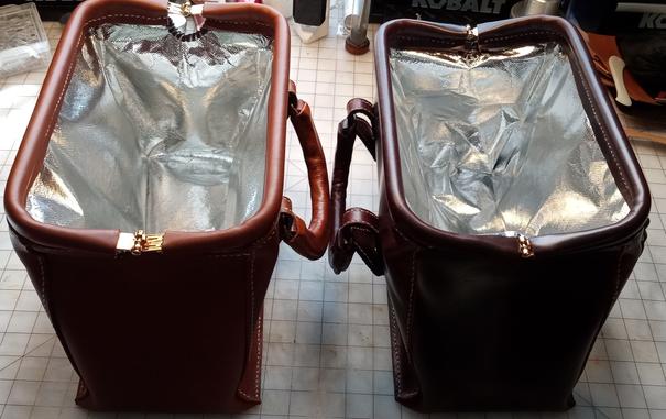 The same bags shown opened, displaying their foiled lining for keeping food hot or cold.