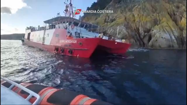 Guardia Costiera (Italian for "can't park there, mate") image of the stricken survey ship embarrassing itself on the rocky shore of Elba.