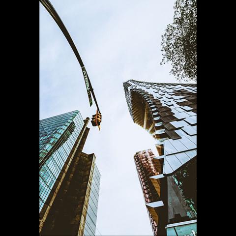 Photo in color of buildings and traffic light with the wide angle. Vancouver, British Columbia, Canada