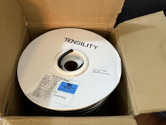 A box of cable for an electronics project.