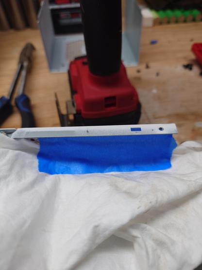 Drilling out holes to allow the top to be reversed