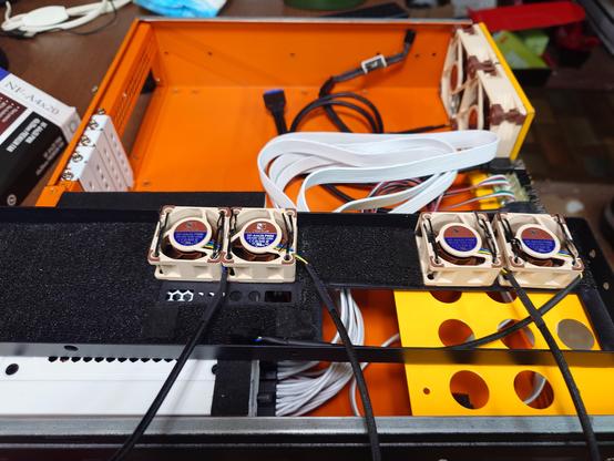 4 x 40mm fans mounted to the front case via twist-ties