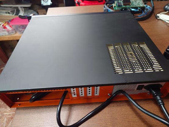 View of back with PSU showing through the grill. Doesn't really match here too well.