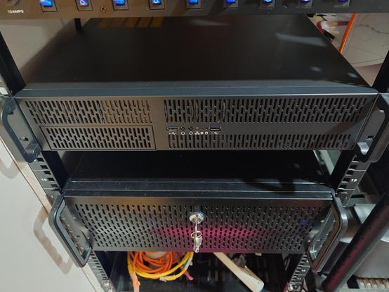 Buttoned up case slid back into the rack. 40mm fan twist ties fairly subtle, think those will work