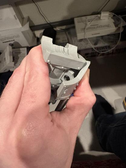 A hand holding shinguards in place. This attempt also failed.
