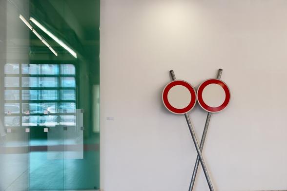 Modern art, two traffic signs on a wall