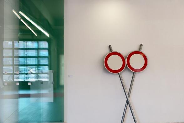 Modern art, two traffic signs on a wall