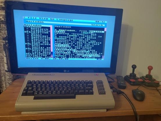Commodore 64 running C64OS 1.07, showing the English Wikipedia page on Mastodon.