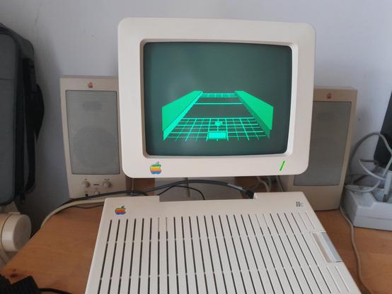 A photo of my Apple IIc with a Shufflepuck table displayed on the screen