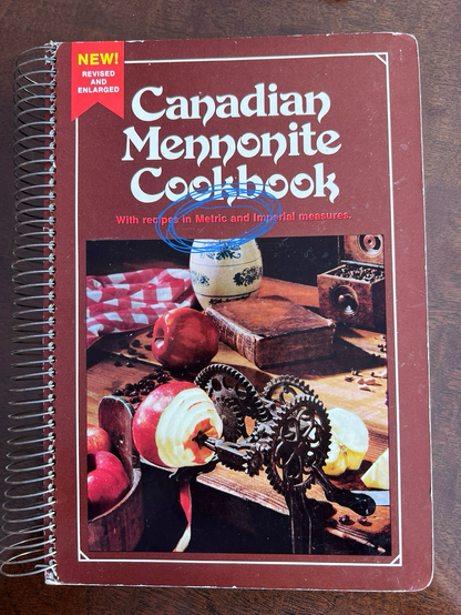Cover of the Canadian Mennonite Cookbook, with the word “Metric” circled.