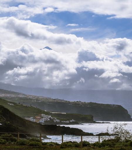 Mount Teide peak peering through the clouds, viewed from El Sauzal cliff shoreline, North Tenerife, Canary Islands
Captured by Komeil Karimi
