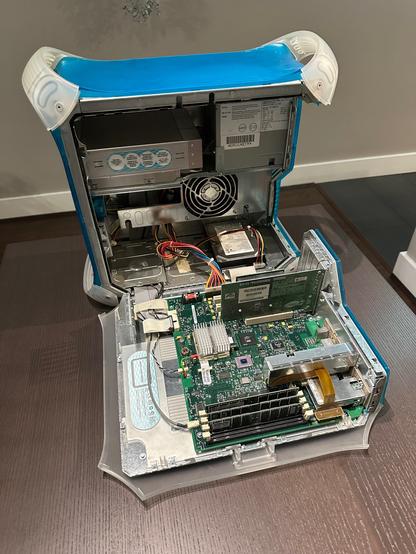 PowerMac G3 blue and white, with case open, showing motherboard, CPU, RAM, hard drive