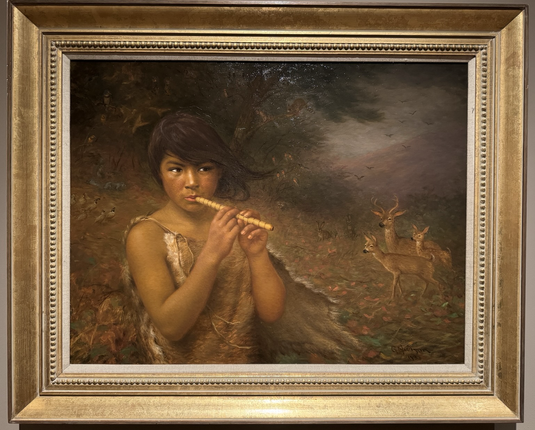 photo of the painting in gold frame on display at museum portrait in landscape orientation of a Pomo child playing a flute in the forest with numerous native Californian woodland animals visible in background, including a trio of deer to right and quail to left