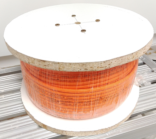 Finished cable reel with cable still shrink-wrapped. The screws and the hole in the center of one of the side walls are visible.
