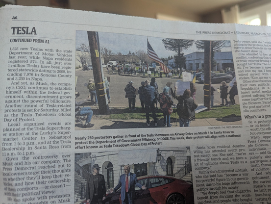 The Press Democrat story continues on page 6 with a picture of the Santa Rosa protest at the Tesla dealership