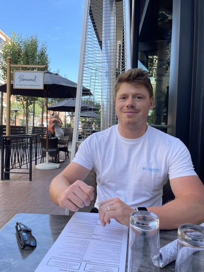 sitting at a cafe and smiling