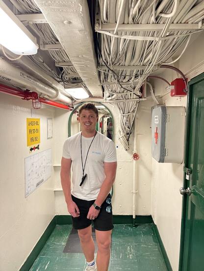 Standing inside USS Midway, with lots of pipes and an industrial feel