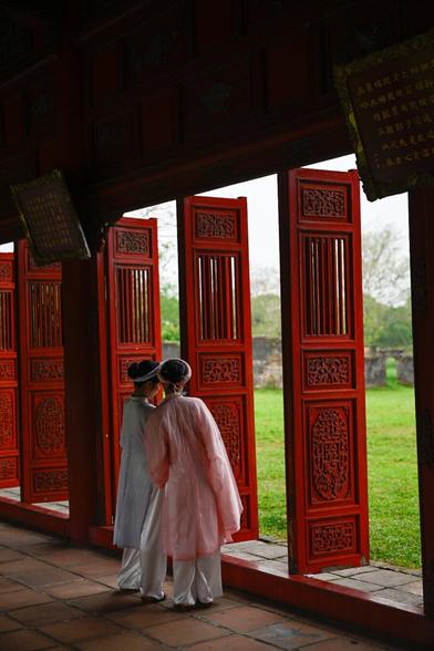 costumed girls taking pictures in the Imperial City