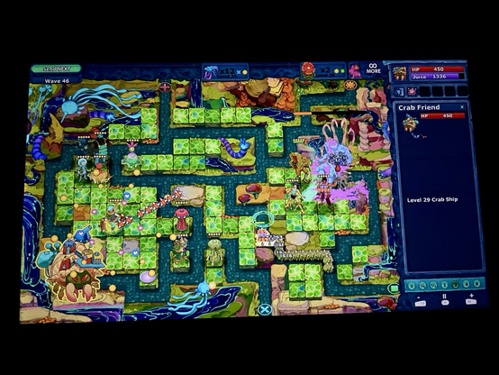 A screenshot showing the gameplay of Defender’s Quest II: Mists of Ruin (PC, 2025). Characters are placed in special tower squares where they automatically attack any enemies that pass by their area of attack. The goal is to protect the two home bases.