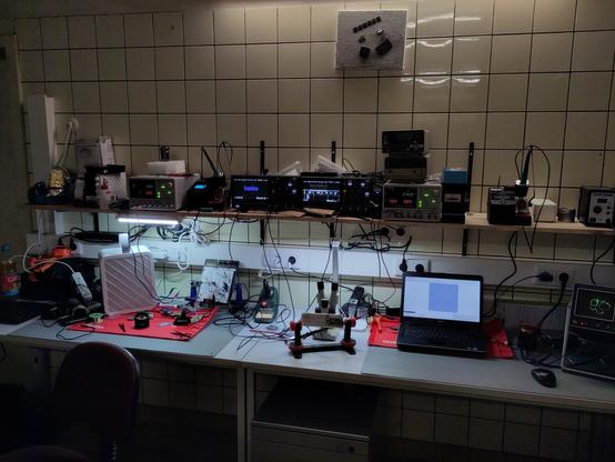 the picture shows devices from the electronic workbench area including a redundancy of oscilloscopes, soldering stations and laboratory power supplies