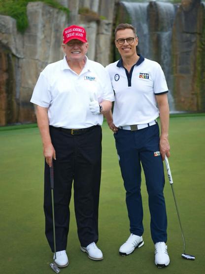 Finnish President Alex Stubb posing together with Donald Trump at a golf course.