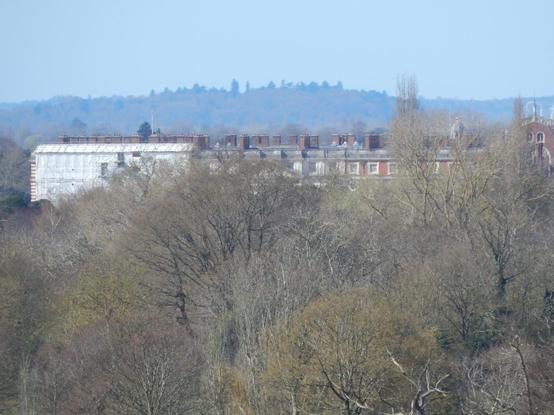 maximum zoom of the Wren facade of Hampton Court Palace, can't really see much because there are trees in the way, but it demonstrates the point; individual windows are visible at 2.3 kilometres