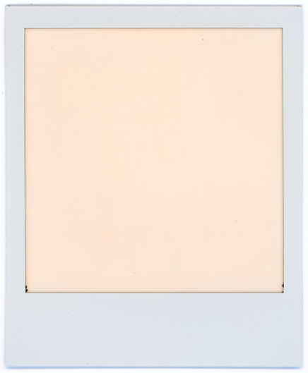 A failed Polaroid exposure presents an ivory square, bordered with dark edges, within a white rectangle.