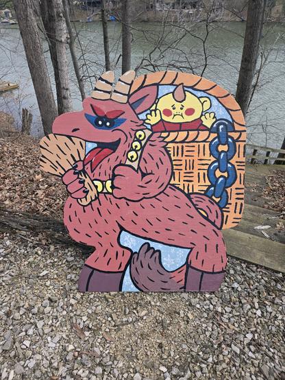 wooden outdoor decoration sign painted of a krampus with a kid