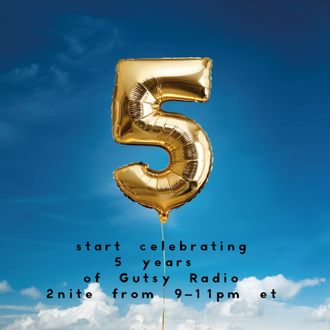 A 5 shaped balloon floats in the sky